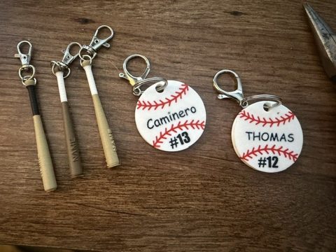 Bat and baseball keychain styles with player names